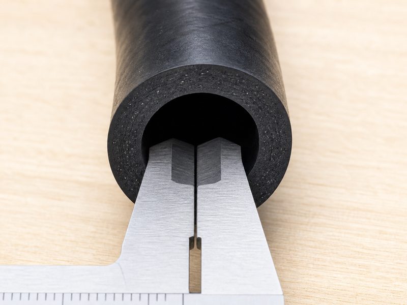 Measuring the inside diameter of an air hose with a digital caliper to confirm the air hose size