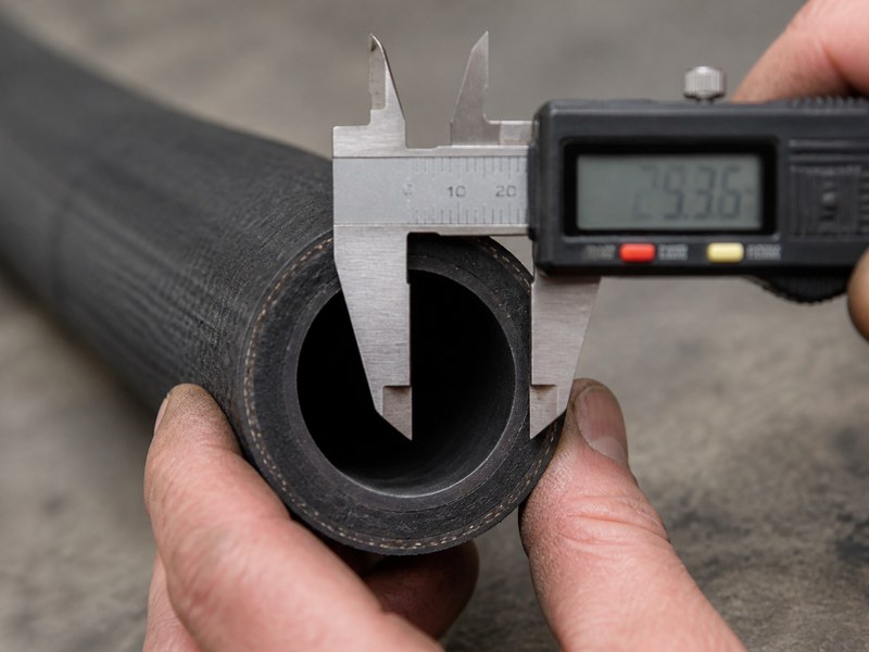 Measuring the inner diameter of a cut transfer hose end with a digital caliper