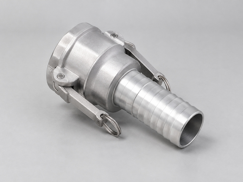 Aluminum camlock chemical hose coupling with cam arms and a hose tail on a bench