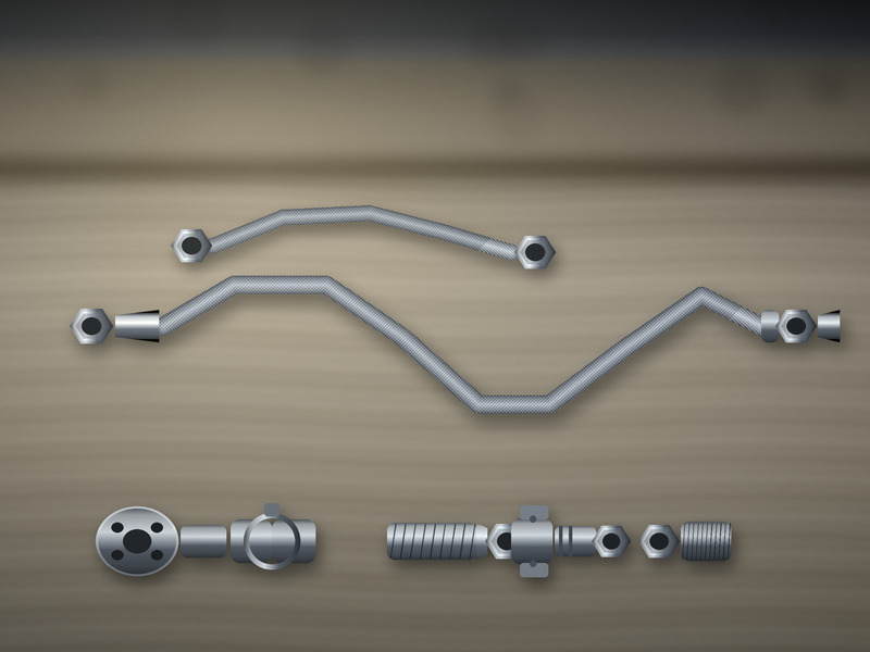 PTFE hose assemblies with stainless steel braid and assorted fittings laid out on a bench
